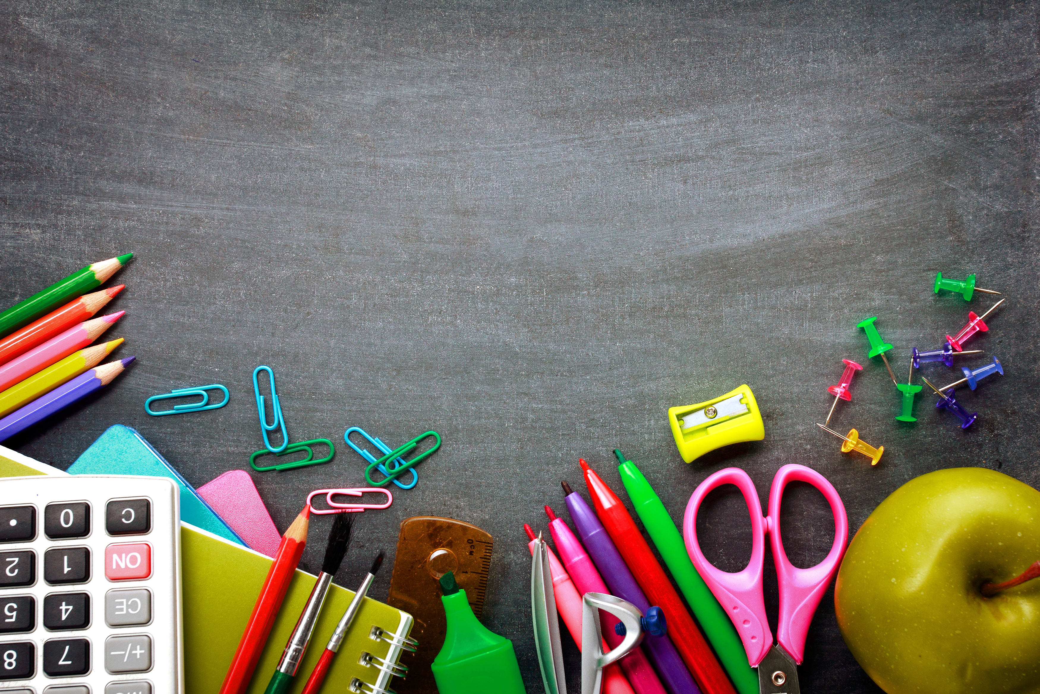 blackboard with school supplies