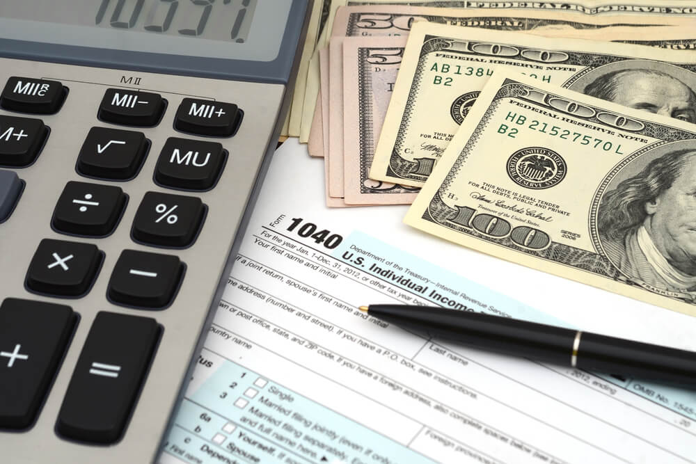 Tax docs, calculator and cash