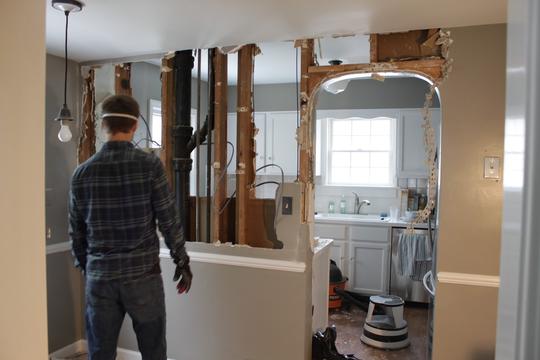 A contractor working in an apartment basement