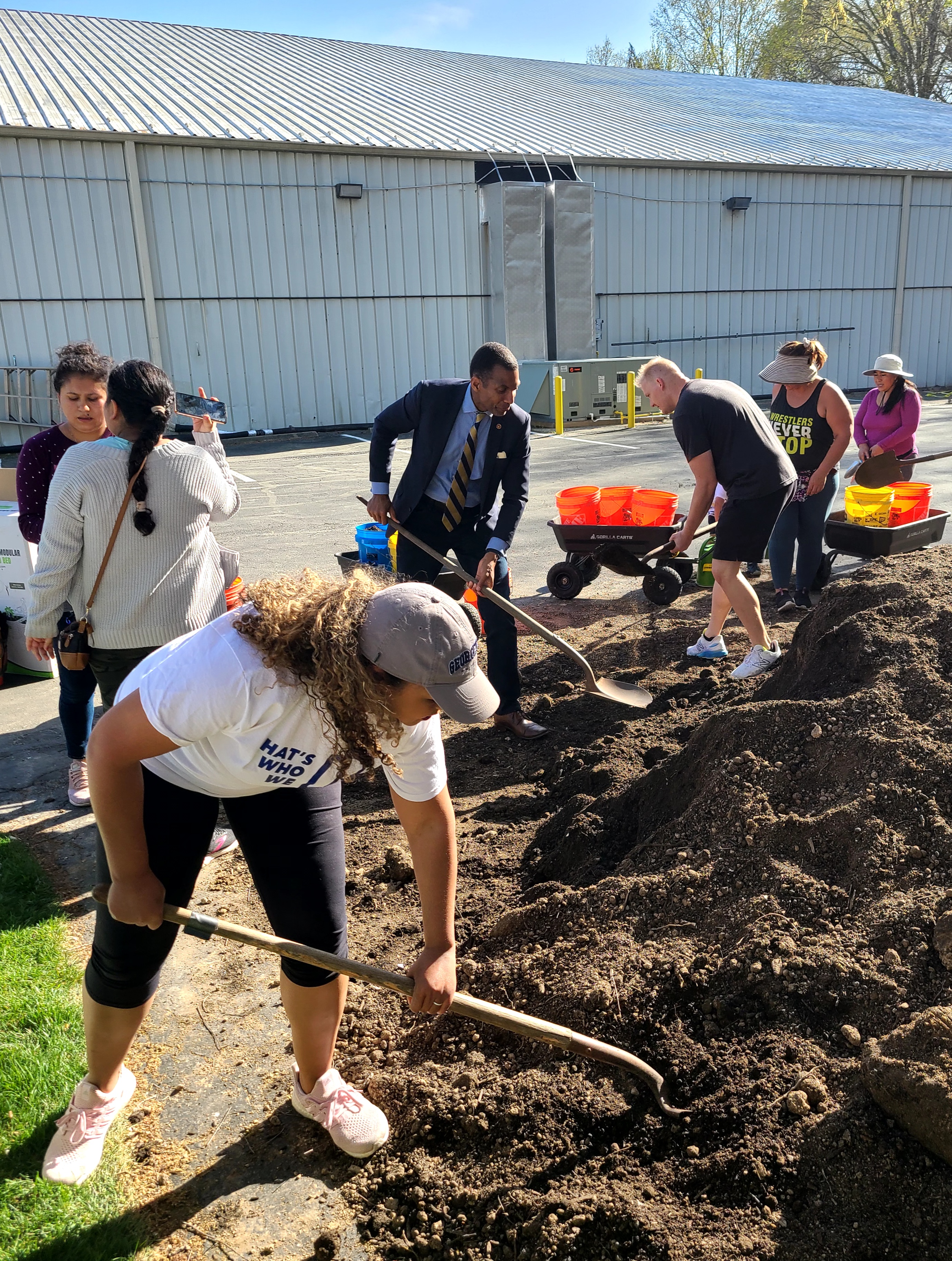 shoveling dirt with supervisor lusk