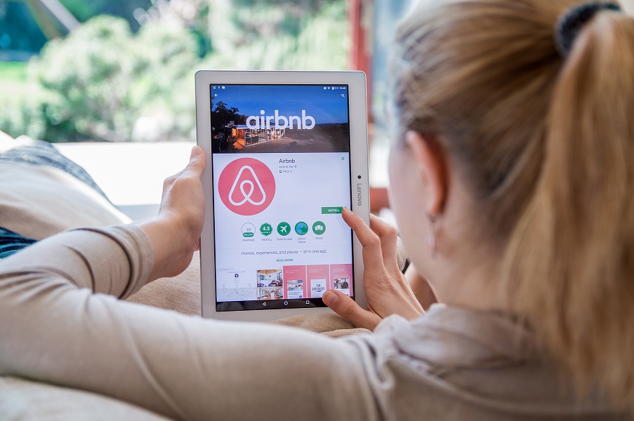 airbnb-shortterm-rental-fairfax Woman scrolling on airbnb