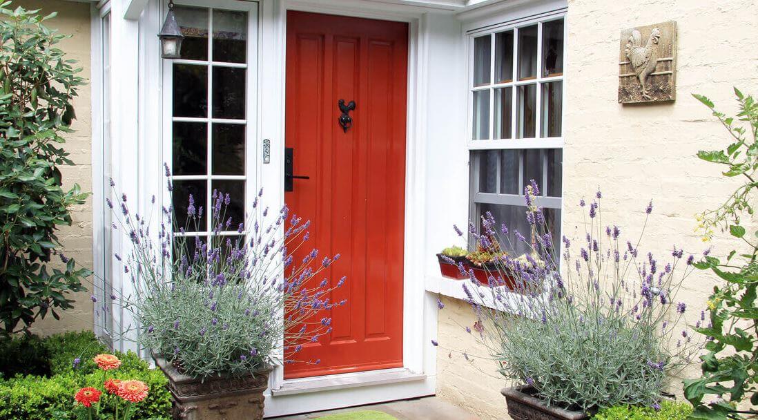 Front entrance with a red door