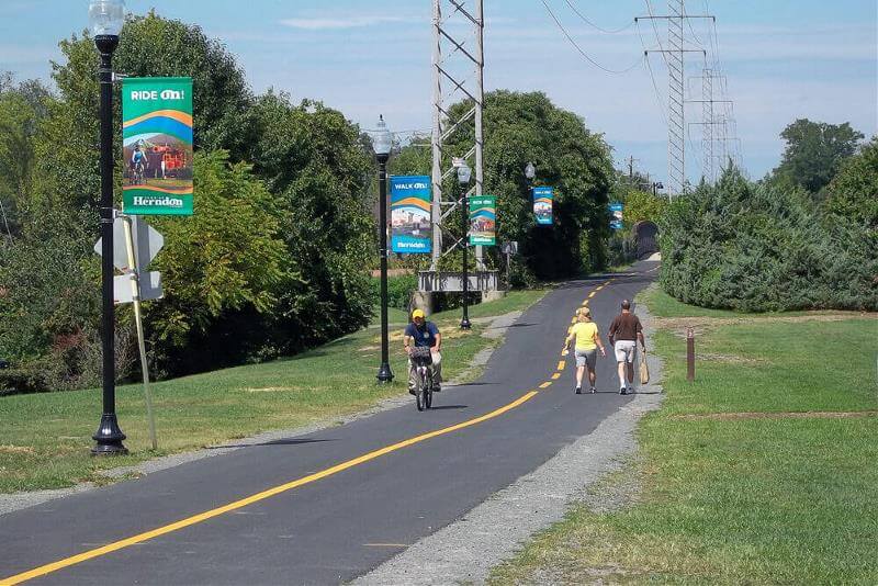 people walking and biking on herndon trail