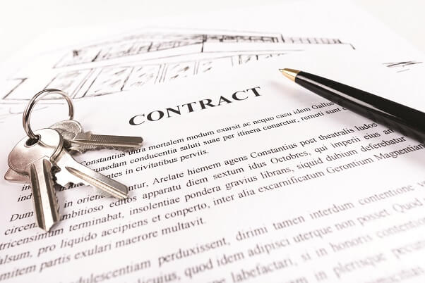 A contract, pen and key