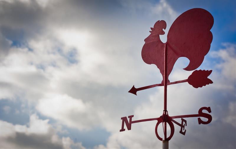 A weathervane pointing to the North