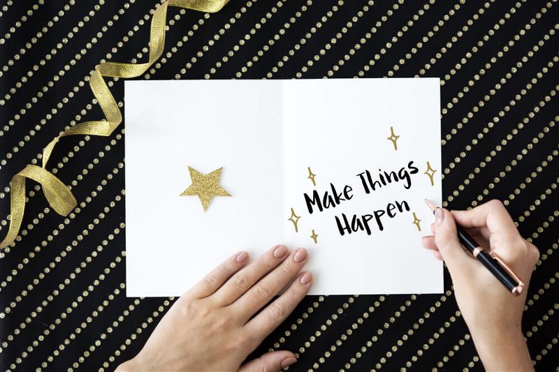 A card that reads - make things happen