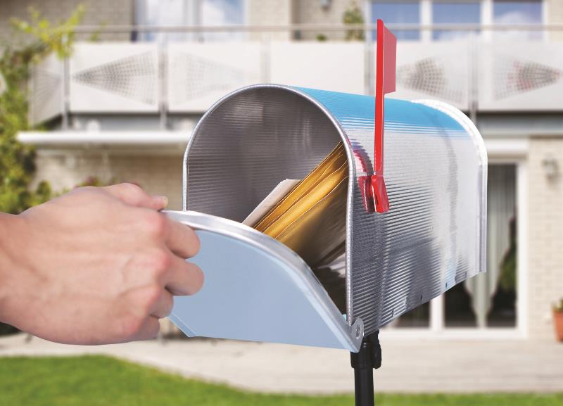 A hand opening a mailbox