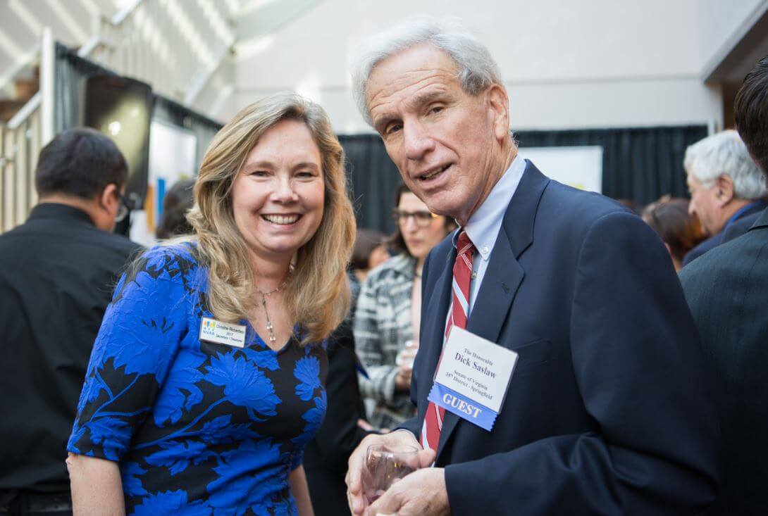 NVAR Board member Christine Richardson of Weichert, Realtors® connects with Senator Dick Saslaw (D).