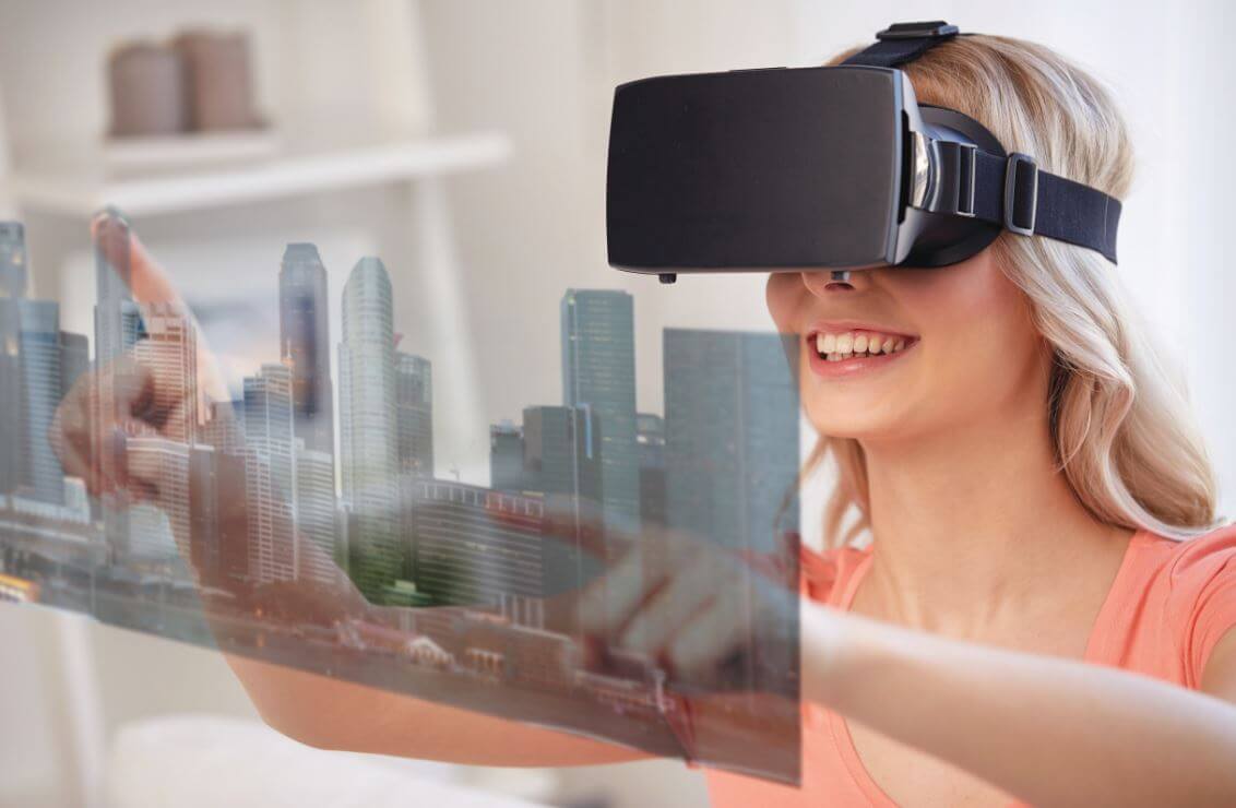 A lady using a 3d virtual image to view housing