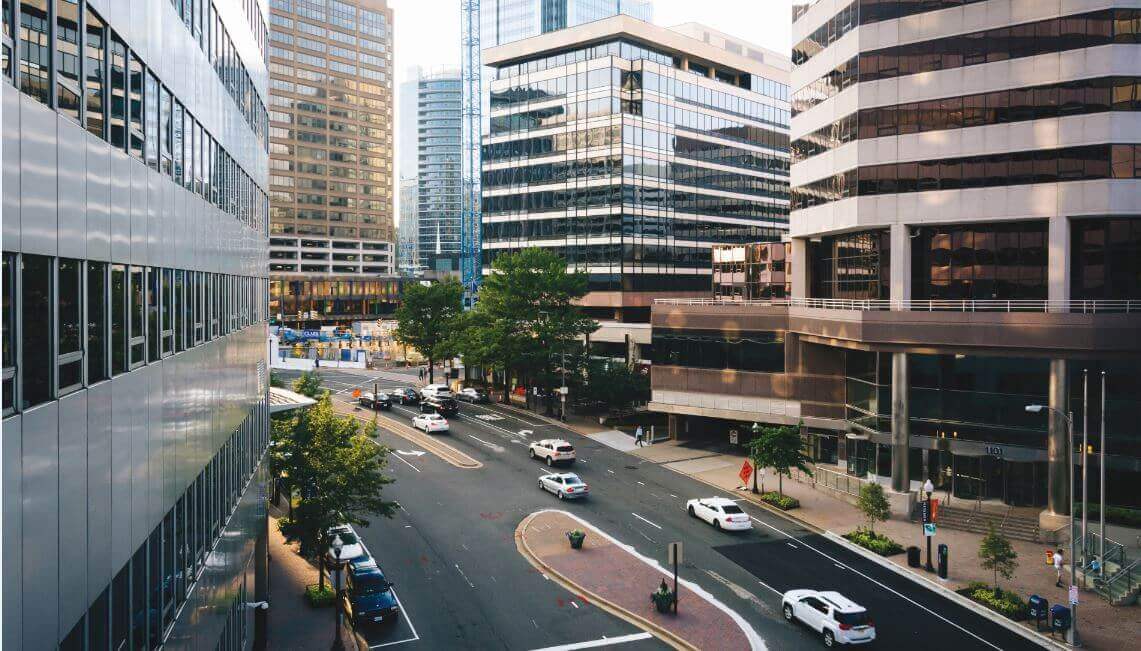 A street view of rosslyn showing traffic and buildings