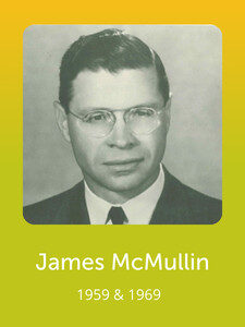 A black and white portrait of a person wearing glasses and a suit. The image has a yellow border with text below it.