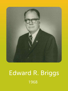 A black-and-white photograph of a person in formal attire with glasses, dated 1968. The background is a solid yellow-green gradient.