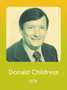 A portrait of a smiling person in formal attire with "Donald Childress 1978" written below on a yellow-green background.