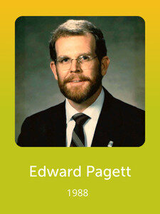 A person with glasses, beard, and suit is featured in a formal portrait from 1988 labeled "Edward Pagett" on a green background.