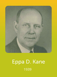 A grayscale portrait of a person in formal attire is displayed against a green-yellow gradient background. The text reads "Eppa D. Kane, 1939."