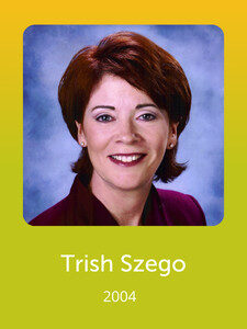 A person smiling in a professional headshot against a blue background, with the name "Trish Szego" and year "2004" displayed below.