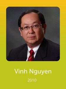 A person in a suit and tie is pictured against a neutral background. The text below reads "Vinh Nguyen 2010" on a green gradient.