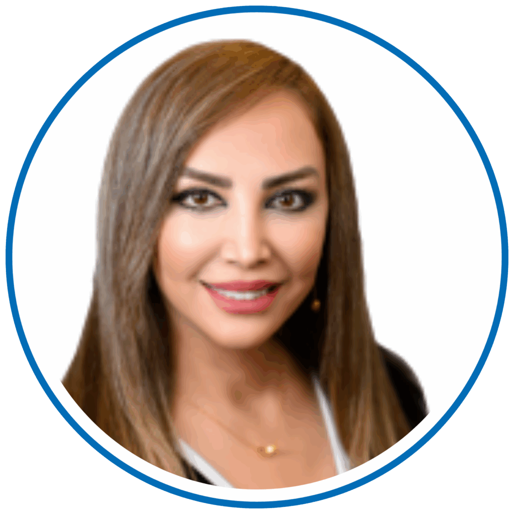 This is a portrait of a person with shoulder-length hair, smiling against a white background, enclosed in a circular frame.