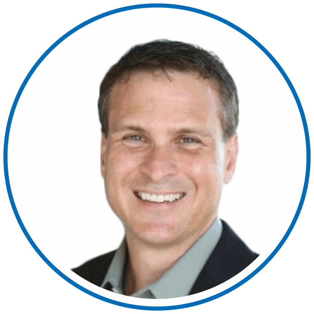 I'm sorry, I don’t know who this person is based on the image provided. It shows a person smiling, wearing a suit, with a plain background.